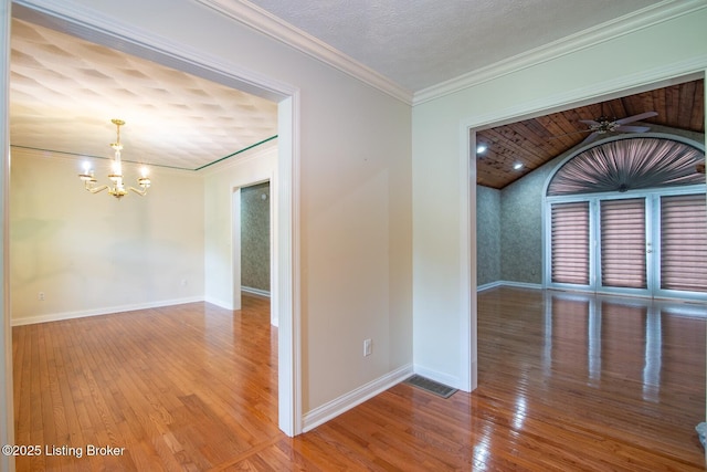 236 Bobwhite Rd, Brandenburg, KY 40108 - unfurnished room with a chandelier, hardwood / wood-style flooring, ceiling fan, ornamental molding, and lofted ceiling