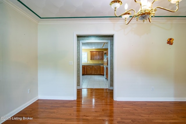 236 Bobwhite Rd, Brandenburg, KY 40108 - empty room with a chandelier, light wood-type flooring, and crown molding