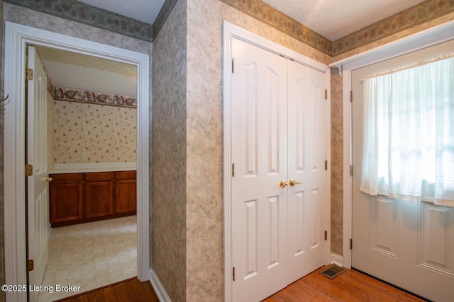 236 Bobwhite Rd, Brandenburg, KY 40108 - foyer entrance with wood finished floors and wallpapered walls
