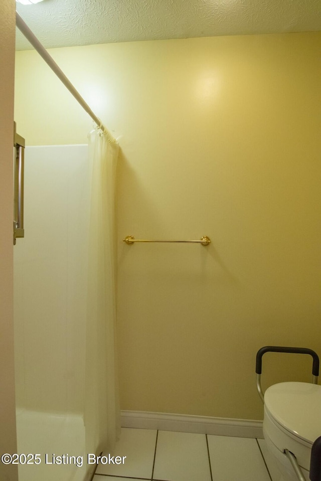 236 Bobwhite Rd, Brandenburg, KY 40108 - full bath with tile patterned flooring, a shower with shower curtain, and a textured ceiling