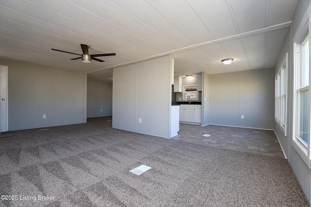 43 Mcfarlin Ln, Vine Grove, KY 40175 - unfurnished living room with carpet floors, a ceiling fan, and healthy amount of natural light