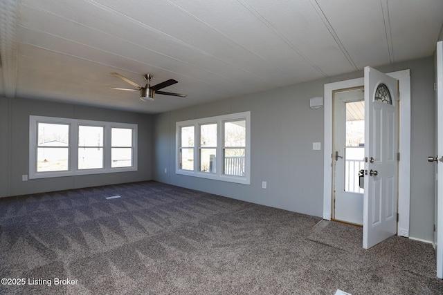 43 Mcfarlin Ln, Vine Grove, KY 40175 - empty room featuring dark carpet and a ceiling fan