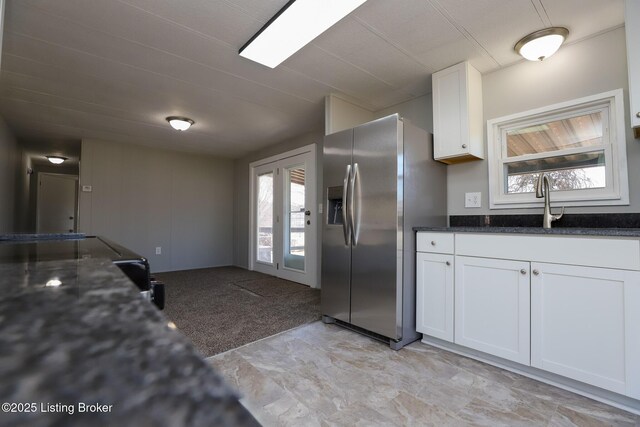 43 Mcfarlin Ln, Vine Grove, KY 40175 - kitchen featuring stainless steel fridge, white cabinets, and dark stone countertops