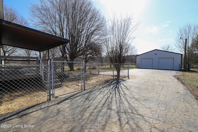 43 Mcfarlin Ln, Vine Grove, KY 40175 - view of yard with a gate, an outbuilding, a garage, and driveway