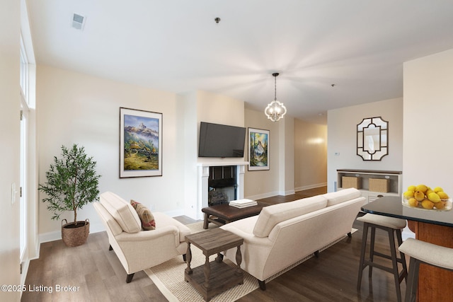 2011 Frankfort Ave Unit Unit312, Louisville, KY 40206 - living area featuring dark wood-type flooring and a fireplace