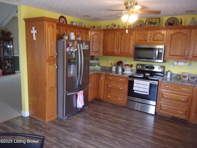 1366 Greens Chapel Rd, Bloomfield, KY 40008 - kitchen featuring stainless steel appliances, ceiling fan, brown cabinets, dark wood-style floors, and dark countertops