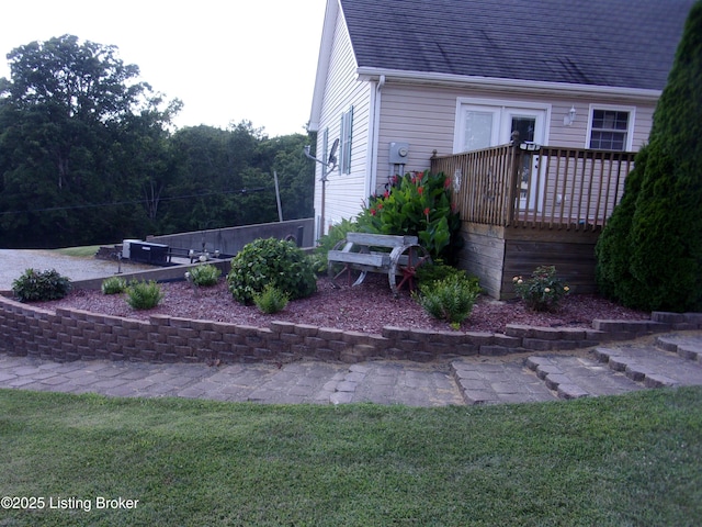 1366 Greens Chapel Rd, Bloomfield, KY 40008 - view of home's exterior featuring a deck, a shingled roof, and a lawn