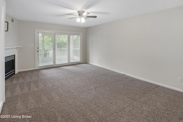 2726 Hollywood Ter Apt 101, Louisville, KY 40206 - unfurnished living room with ceiling fan, a fireplace, and carpet flooring