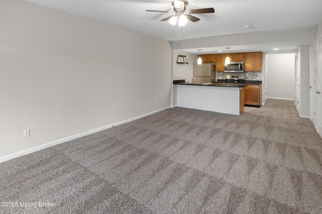 2726 Hollywood Ter Apt 101, Louisville, KY 40206 - unfurnished living room with light carpet, a ceiling fan, and recessed lighting