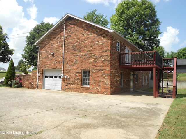 732 Poplar Flat Rd, Bardstown, KY 40004 - view of home's exterior with brick siding, a deck, stairway, concrete driveway, and an attached garage