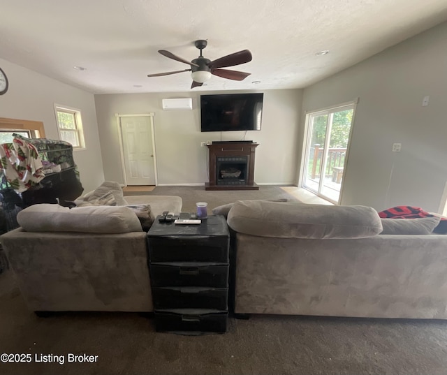 40 Sunflower Ln, Brandenburg, KY 40108 - carpeted living room with a fireplace, plenty of natural light, ceiling fan, and an AC wall unit