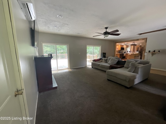 40 Sunflower Ln, Brandenburg, KY 40108 - carpeted living room featuring ceiling fan, an AC wall unit, and a textured ceiling