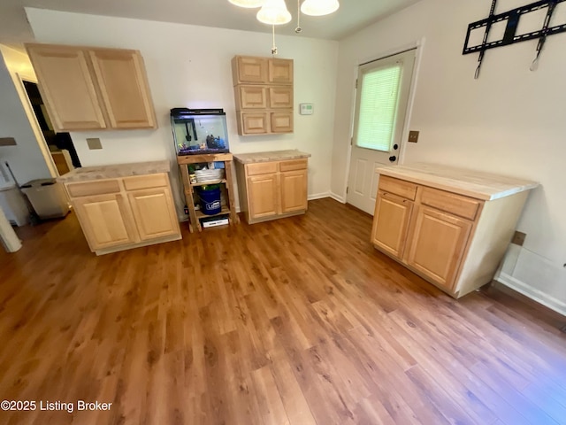 40 Sunflower Ln, Brandenburg, KY 40108 - kitchen featuring light brown cabinetry, light wood-style flooring, light countertops, and a ceiling fan