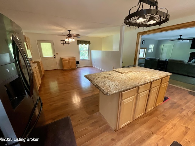 40 Sunflower Ln, Brandenburg, KY 40108 - kitchen featuring open floor plan, a ceiling fan, freestanding refrigerator, and light wood finished floors