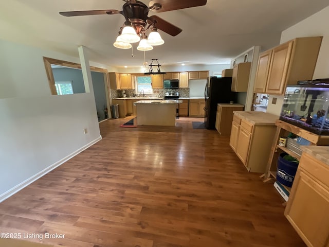 40 Sunflower Ln, Brandenburg, KY 40108 - kitchen with appliances with stainless steel finishes, a center island, ceiling fan, dark wood-style flooring, and tasteful backsplash