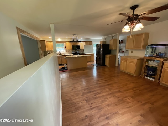 40 Sunflower Ln, Brandenburg, KY 40108 - kitchen with black appliances, wood finished floors, backsplash, a ceiling fan, and light countertops