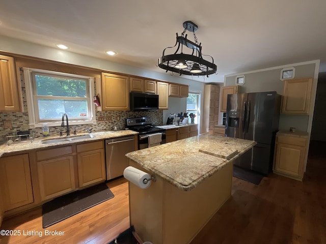 40 Sunflower Ln, Brandenburg, KY 40108 - kitchen with appliances with stainless steel finishes, a center island, light wood finished floors, healthy amount of natural light, and recessed lighting