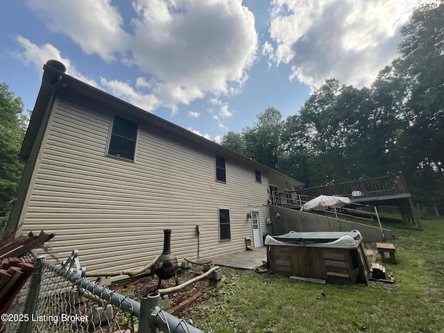 40 Sunflower Ln, Brandenburg, KY 40108 - back of house with a hot tub, a wooden deck, a patio, and a lawn