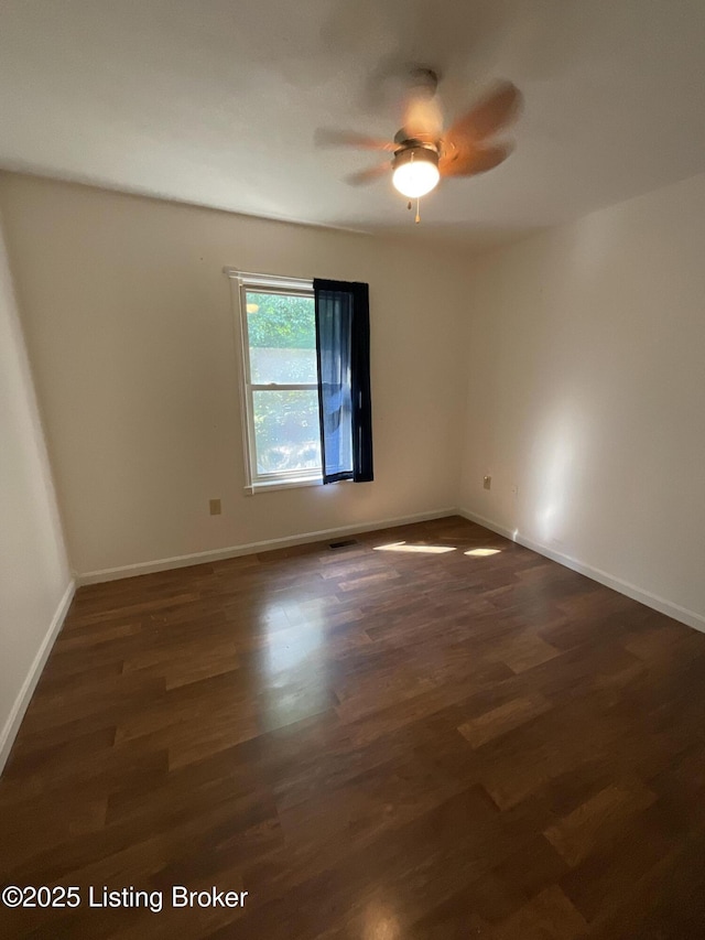 40 Sunflower Ln, Brandenburg, KY 40108 - empty room with a ceiling fan and dark wood-type flooring