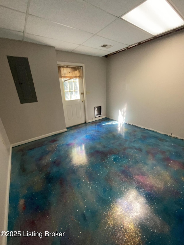 40 Sunflower Ln, Brandenburg, KY 40108 - unfurnished room with electric panel, a drop ceiling, and concrete floors