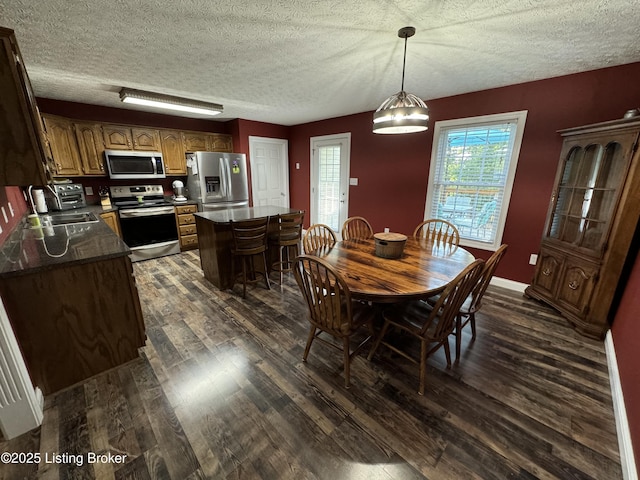 79 Brightberry Rd, Brandenburg, KY 40108 - dining area featuring dark wood-style flooring and a textured ceiling