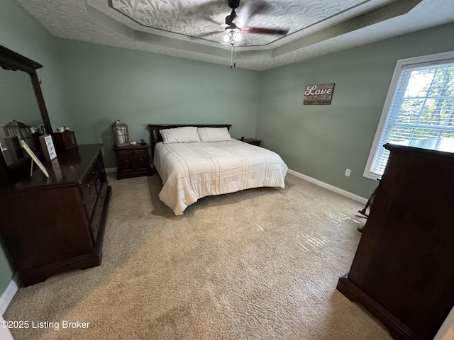 79 Brightberry Rd, Brandenburg, KY 40108 - bedroom featuring a tray ceiling, light colored carpet, and ceiling fan