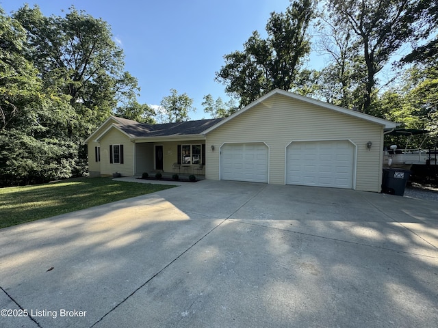 79 Brightberry Rd, Brandenburg, KY 40108 - single story home with an attached garage, covered porch, concrete driveway, and a front lawn