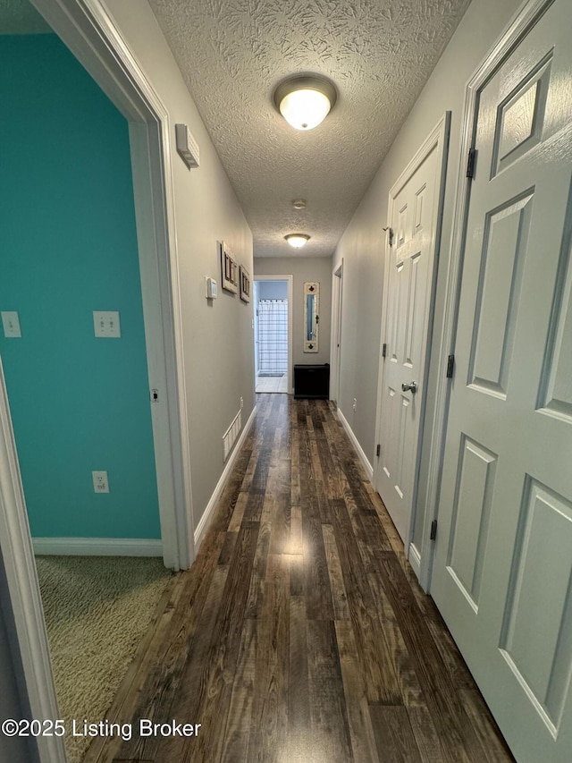 79 Brightberry Rd, Brandenburg, KY 40108 - corridor with dark wood-style flooring and a textured ceiling
