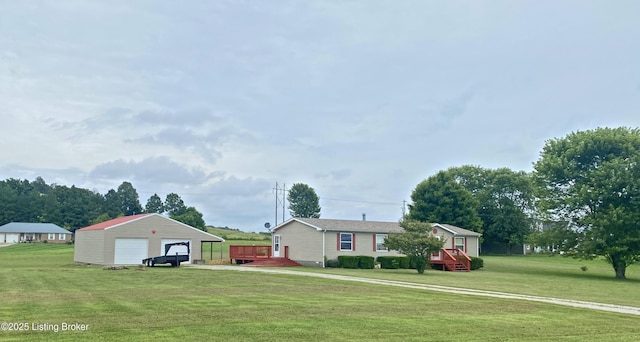 356 Armes Lively Rd, Leitchfield, KY 42754 - view of grassy yard with an outbuilding, a detached garage, and a wooden deck
