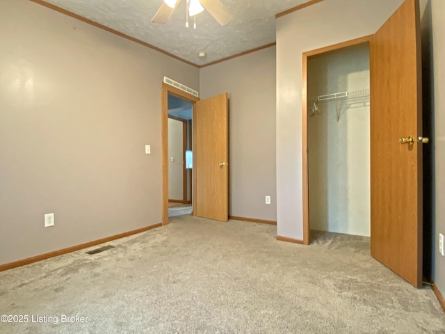 356 Armes Lively Rd, Leitchfield, KY 42754 - unfurnished bedroom with ornamental molding, carpet flooring, a closet, ceiling fan, and a textured ceiling