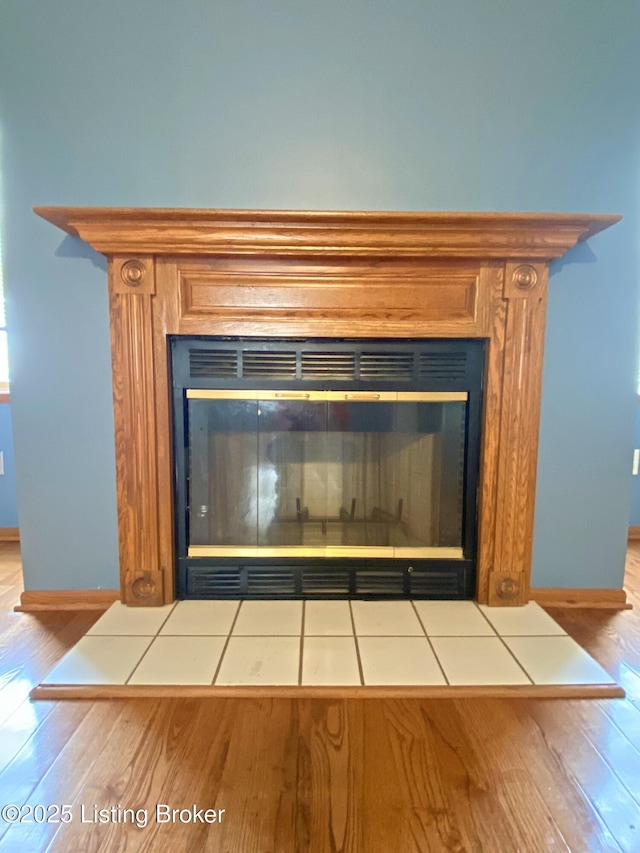 356 Armes Lively Rd, Leitchfield, KY 42754 - detailed view of a glass covered fireplace and wood finished floors