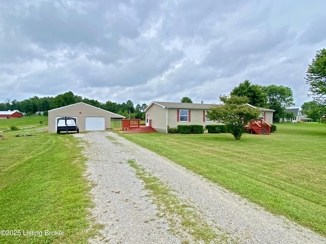 356 Armes Lively Rd, Leitchfield, KY 42754 - view of front of house featuring an outbuilding, a detached garage, a wooden deck, and a front lawn