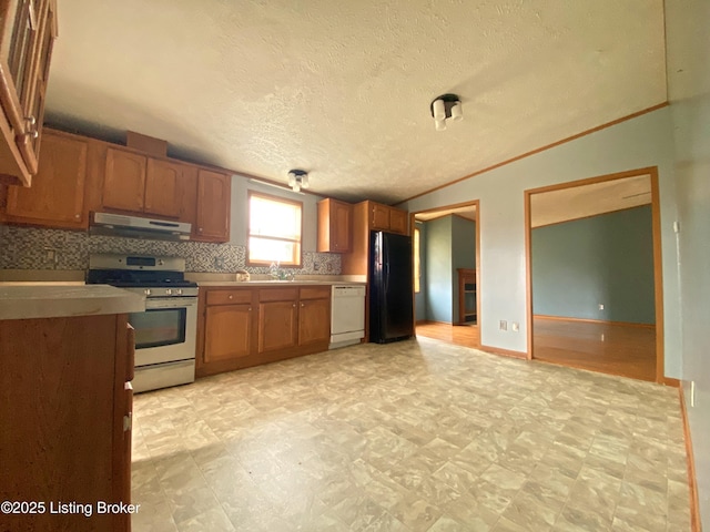356 Armes Lively Rd, Leitchfield, KY 42754 - kitchen featuring gas range, white dishwasher, freestanding refrigerator, under cabinet range hood, and light countertops