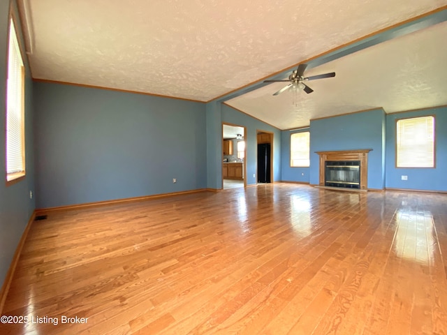 356 Armes Lively Rd, Leitchfield, KY 42754 - unfurnished living room featuring ceiling fan, wood finished floors, a textured ceiling, and a glass covered fireplace