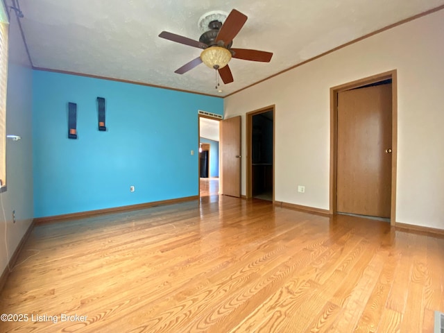 356 Armes Lively Rd, Leitchfield, KY 42754 - empty room with wood finished floors, ceiling fan, and crown molding