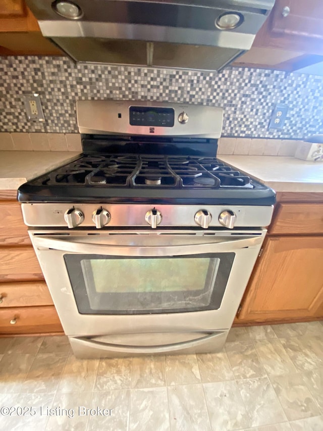 356 Armes Lively Rd, Leitchfield, KY 42754 - kitchen view of gas range, light countertops, and tasteful backsplash