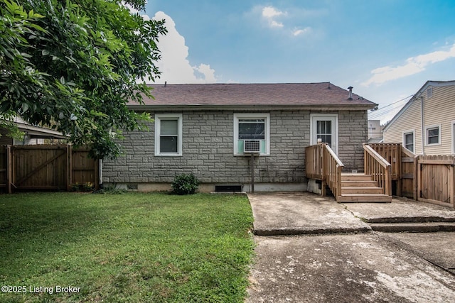 218 N Mantle Ave, Elizabethtown, KY 42701 - back of house with stone siding, a fenced backyard, a gate, a patio, and roof with shingles