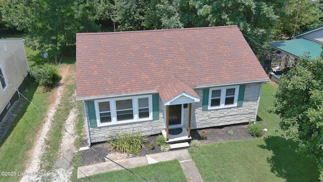 218 N Mantle Ave, Elizabethtown, KY 42701 - view of front of property featuring stone siding, a shingled roof, and a front lawn