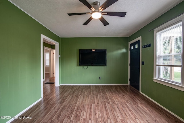 218 N Mantle Ave, Elizabethtown, KY 42701 - unfurnished living room with wood finished floors, a textured ceiling, plenty of natural light, and a ceiling fan