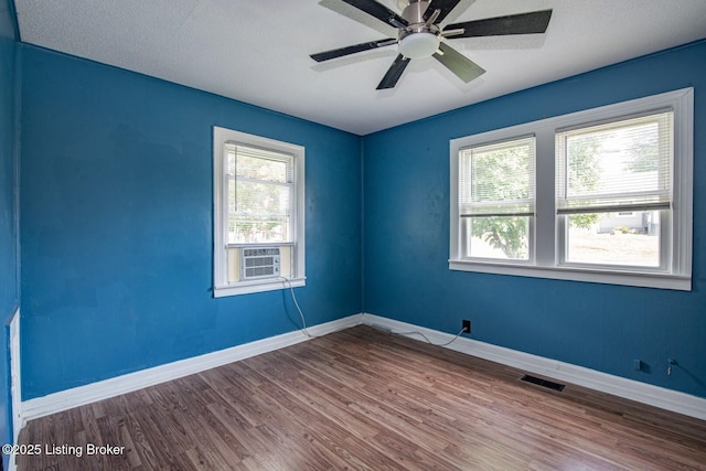 218 N Mantle Ave, Elizabethtown, KY 42701 - unfurnished room featuring wood finished floors, a ceiling fan, and cooling unit
