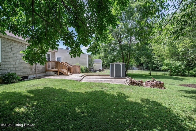 218 N Mantle Ave, Elizabethtown, KY 42701 - fenced backyard with a fire pit and a storage shed