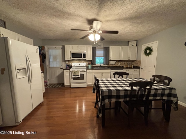 936 Old Ekron Rd, Brandenburg, KY 40108 - kitchen featuring white appliances, dark wood-type flooring, white cabinets, a textured ceiling, and ceiling fan