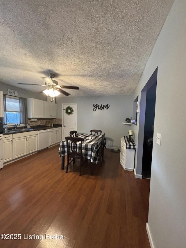 936 Old Ekron Rd, Brandenburg, KY 40108 - dining room featuring a textured ceiling, dark wood-style flooring, and a ceiling fan