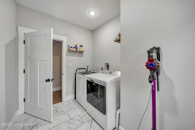90 Glenn Eagle Rd, Brandenburg, KY 40108 - laundry room with washing machine and dryer, light marble finish flooring, and a textured ceiling