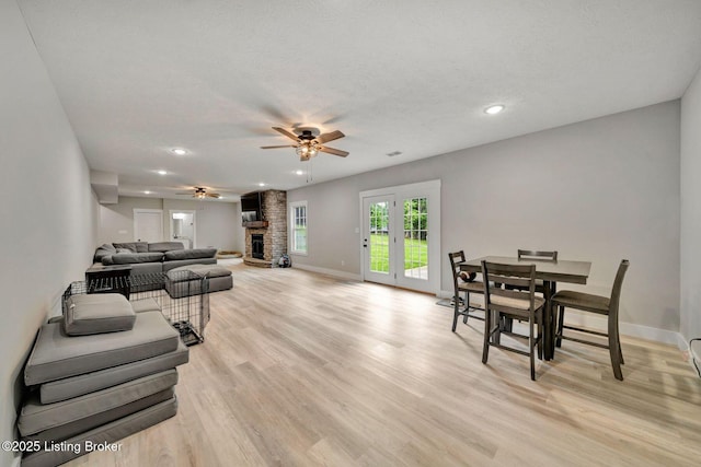 90 Glenn Eagle Rd, Brandenburg, KY 40108 - living room featuring a ceiling fan, recessed lighting, light wood-type flooring, and a large fireplace