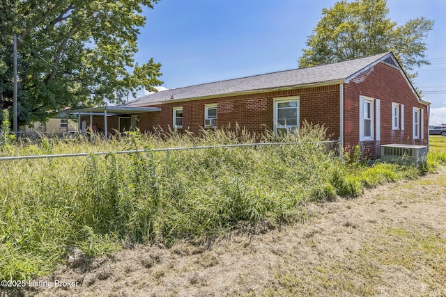 2904 State Route 58 E, Mayfield, KY 42066 - back of house featuring brick siding and roof with shingles