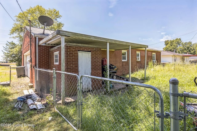 2904 State Route 58 E, Mayfield, KY 42066 - view of front of home featuring brick siding and a gate