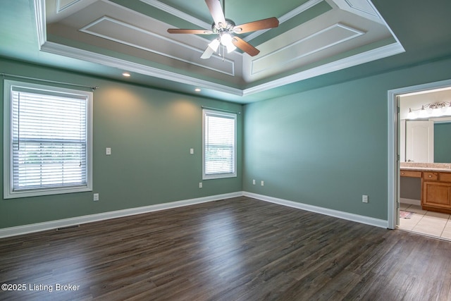 515 Clymene Rd, Cecilia, KY 42724 - spare room with a tray ceiling, dark wood-style floors, a ceiling fan, and crown molding