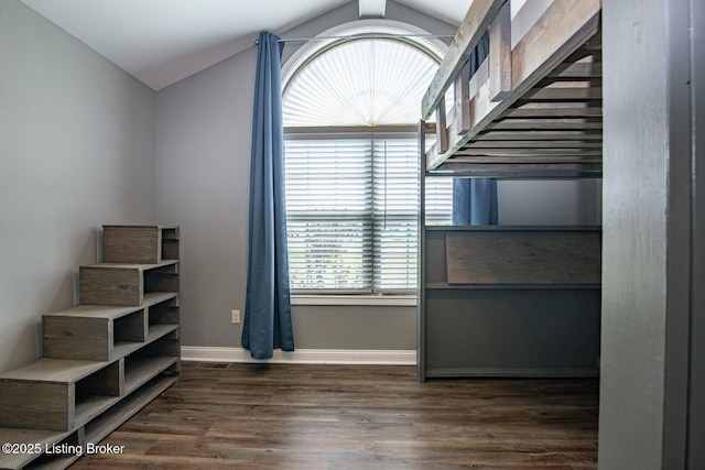 515 Clymene Rd, Cecilia, KY 42724 - unfurnished bedroom featuring vaulted ceiling and wood finished floors