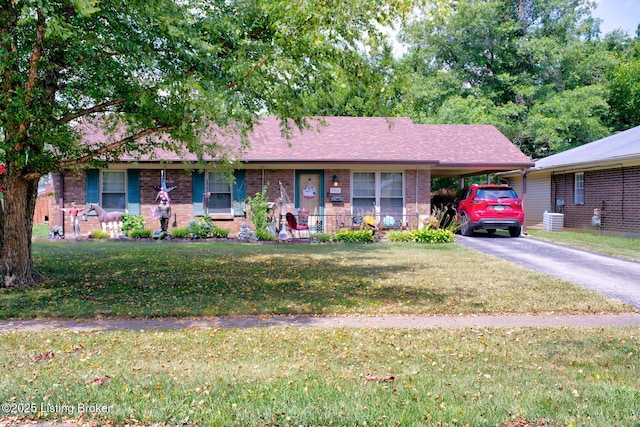 3308 Mcadams Ct, Jeffersontown, KY 40299 - ranch-style house featuring a carport, asphalt driveway, a front lawn, and brick siding